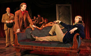 A man lies on a chaise lounge while two others look on in Sherlock Holmes and the West End Horror.